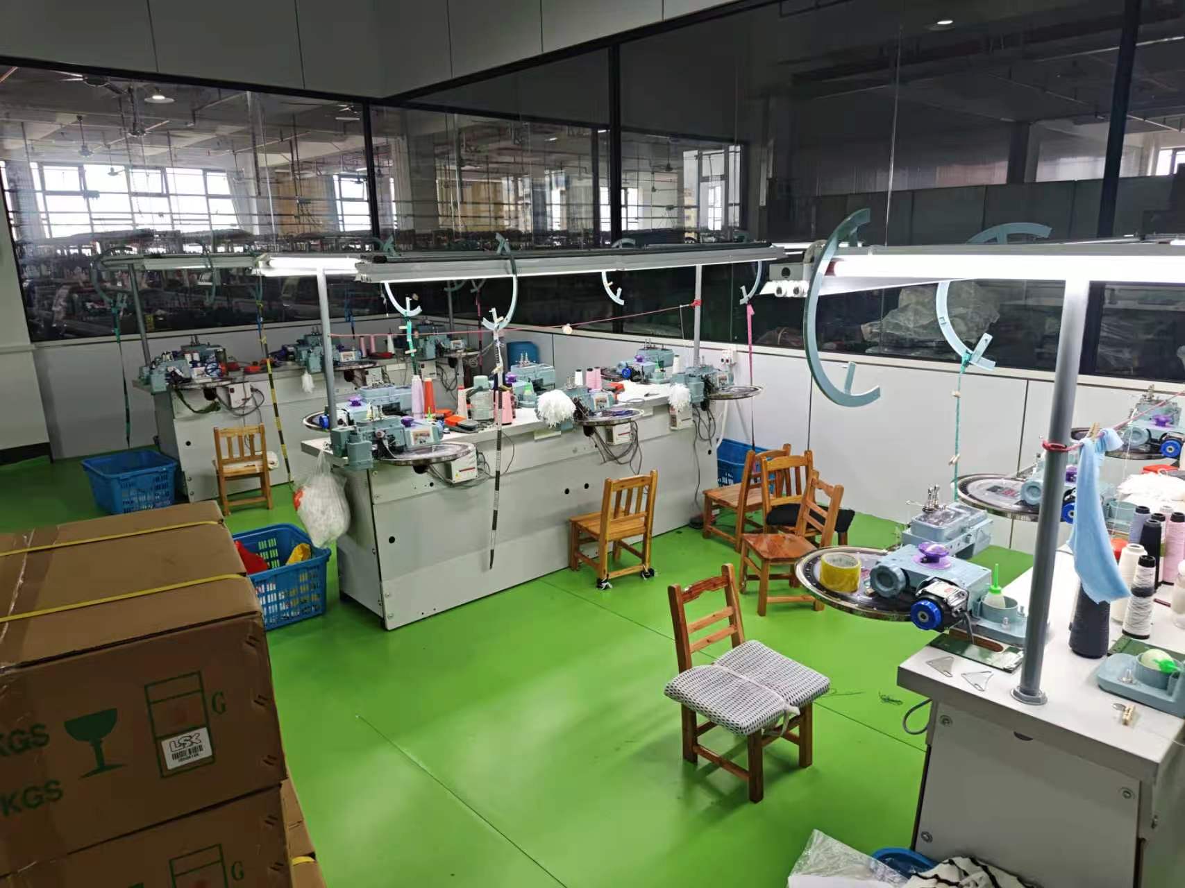 Sweater linking workshop and garment assembly
