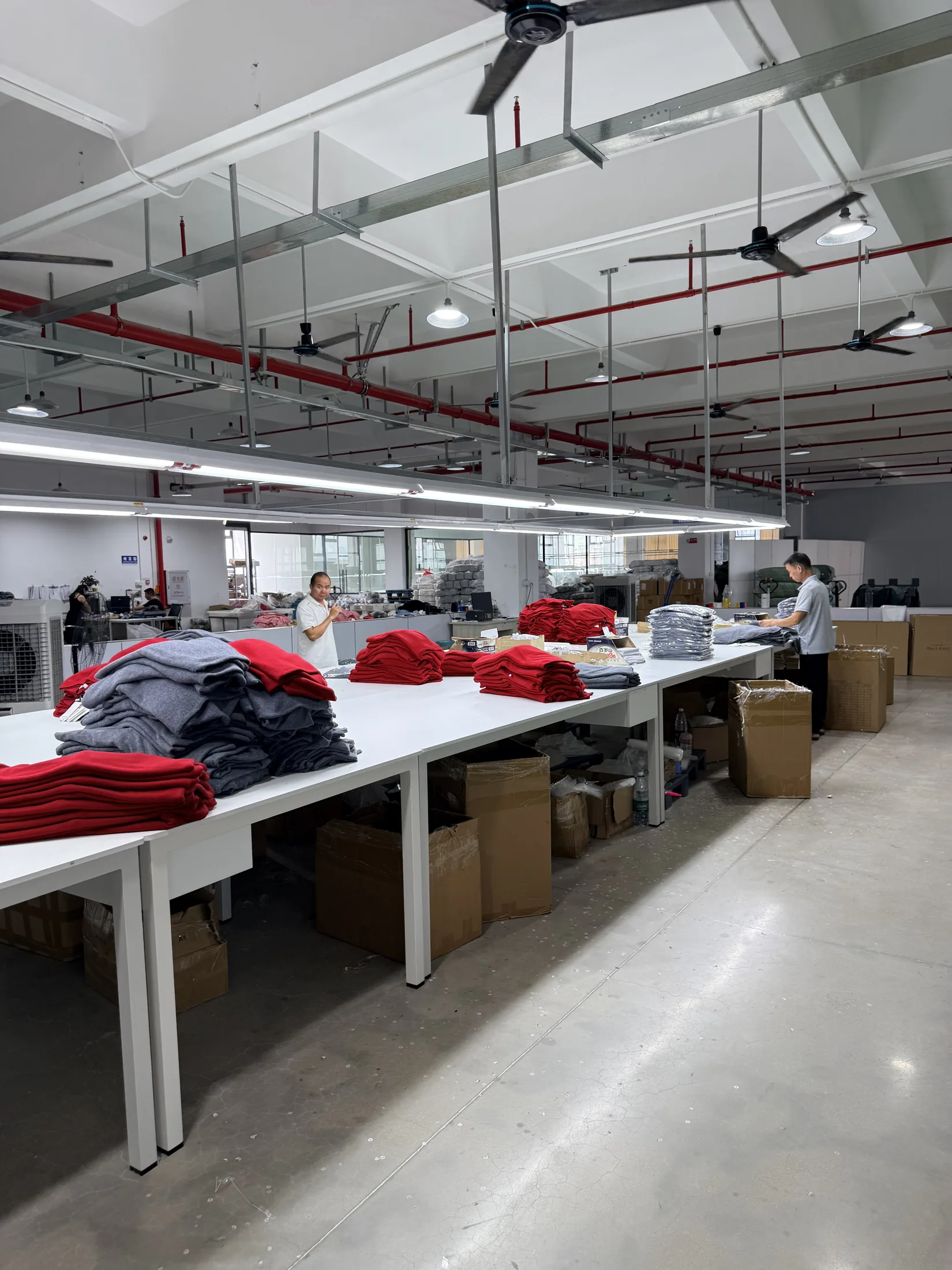 Knitwear production workstations at Rishi Apparel in Dongguan